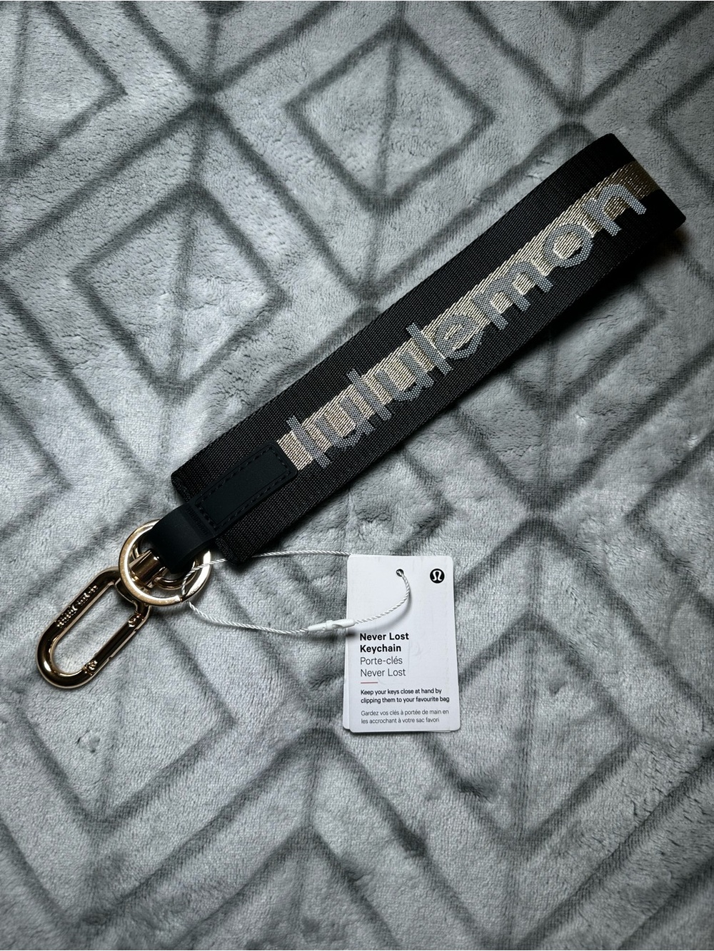 lululemon athletica Black and Gold Never Lost Keychain Wristlet
